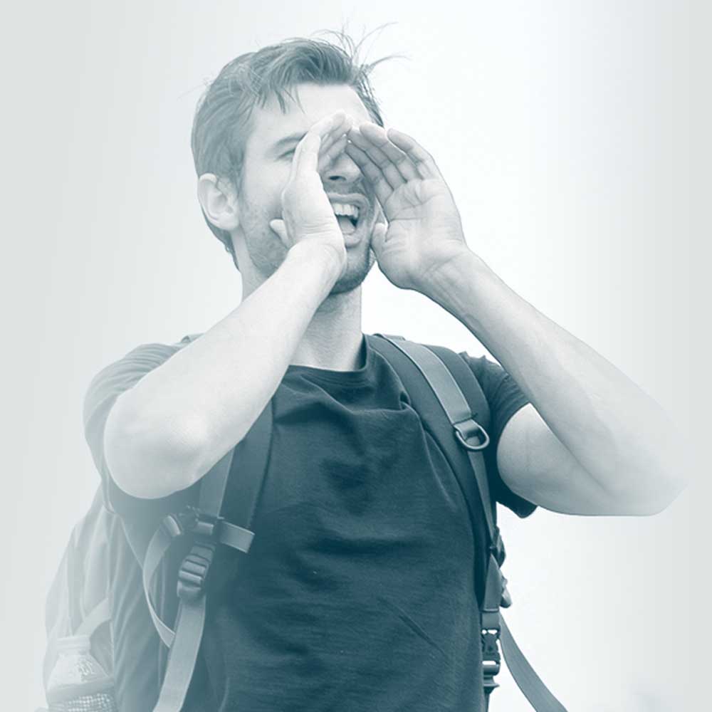 Photo of a man wearing a backpack, yelling out with his hands cupped around his mouth. Showing how our employee benefits company helps you to communicate.